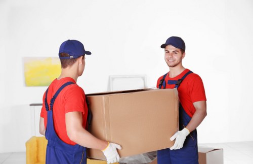 Moving boxes and furniture being placed into self storage in Hounslow