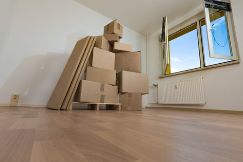 Careful wrapping and boxing of household items for relocation