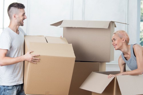 Professional movers handling furniture in a local Hounslow property